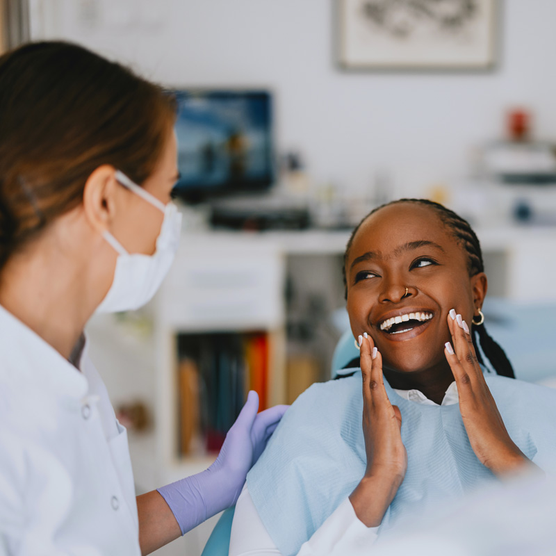 dentist and patient smiling